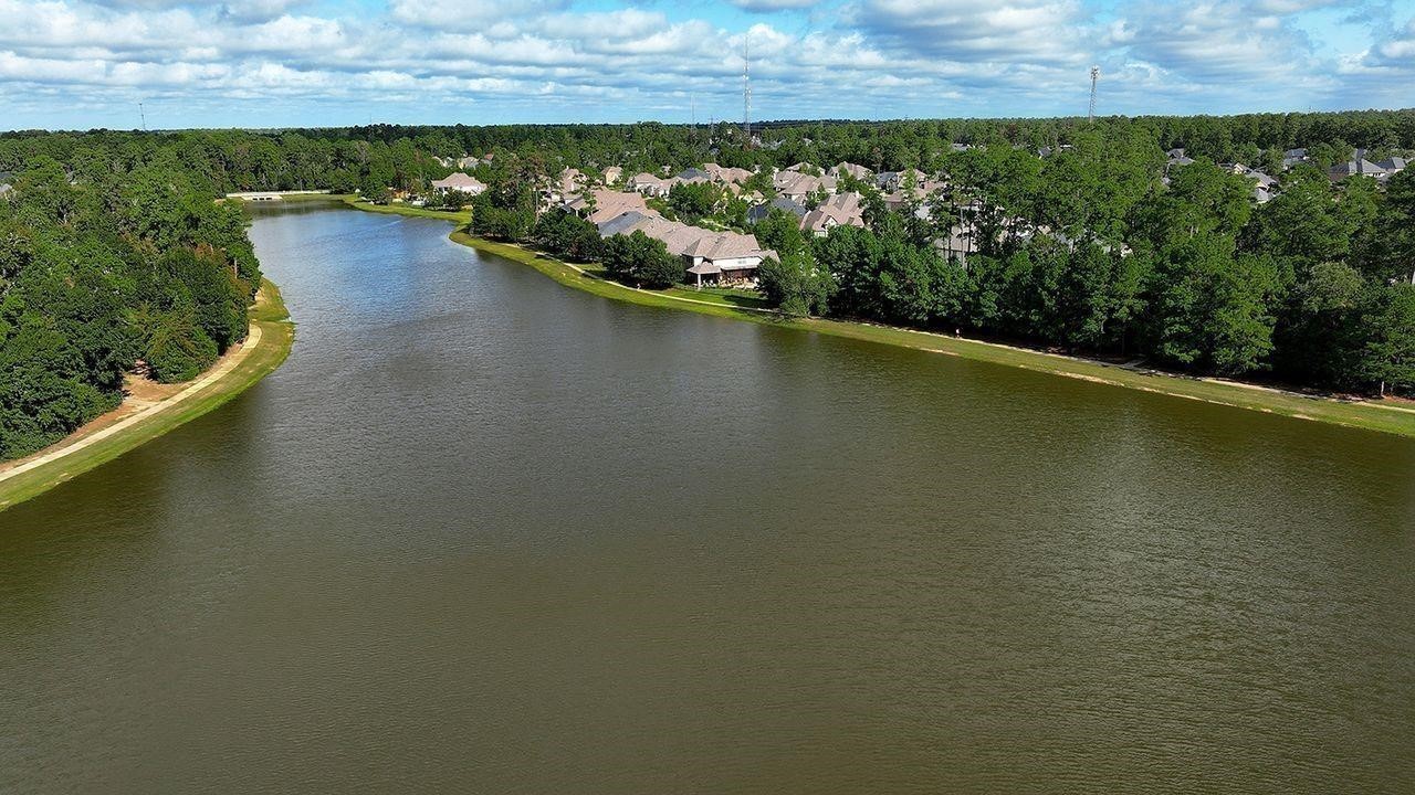 330 Mill Creek Road Pinehurst, TX 77362 - Photo 33 of 36 a view of a lake with a city