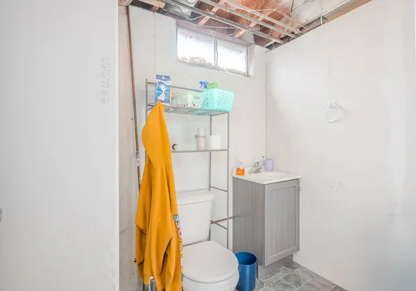 a bathroom with a sink a toilet and tub