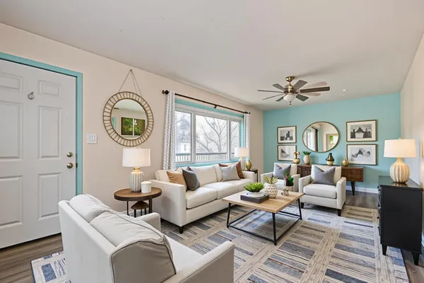 a living room with furniture and a large window