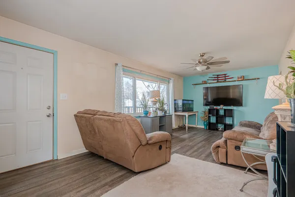 a living room with furniture and a flat screen tv