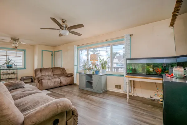 a living room with furniture and a large window