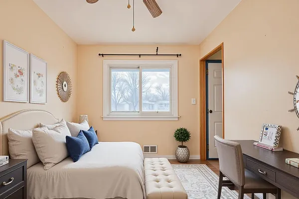a bedroom with a bed and a window