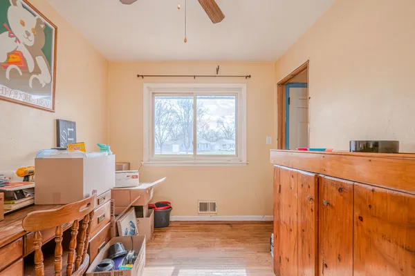 a bedroom with furniture and a window