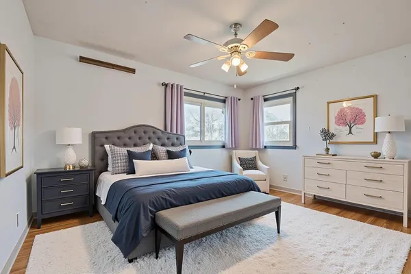 a bedroom with a bed and a dresser