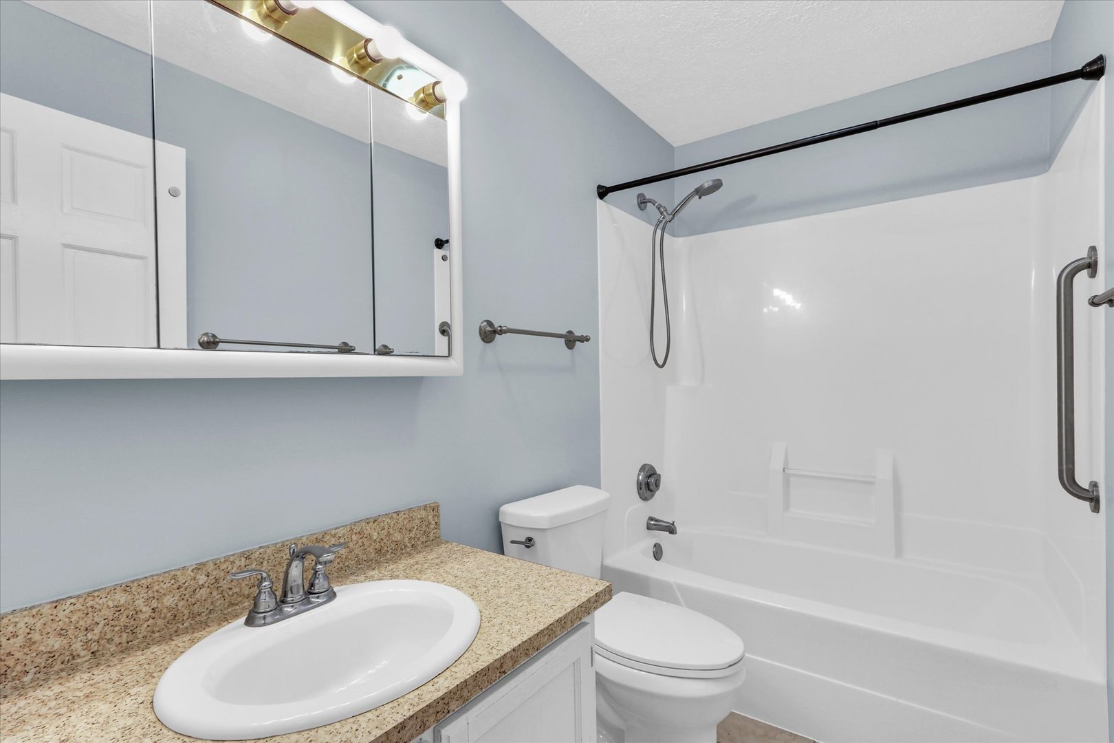 2302 Pheasant Ridge Road Mahomet, IL 61853 - Photo 12 of 31 a bathroom with a sink toilet and shower