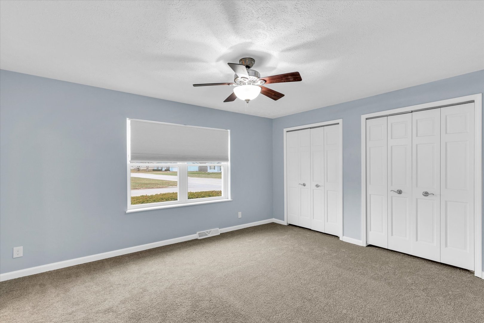 2302 Pheasant Ridge Road Mahomet, IL 61853 - Photo 15 of 31 a view of room with a ceiling fan and a window