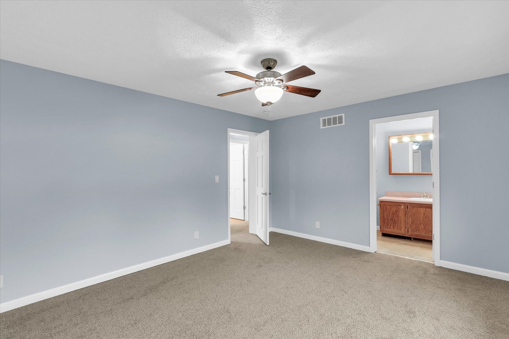 2302 Pheasant Ridge Road Mahomet, IL 61853 - Photo 16 of 31 a view of a livingroom with a ceiling fan and window