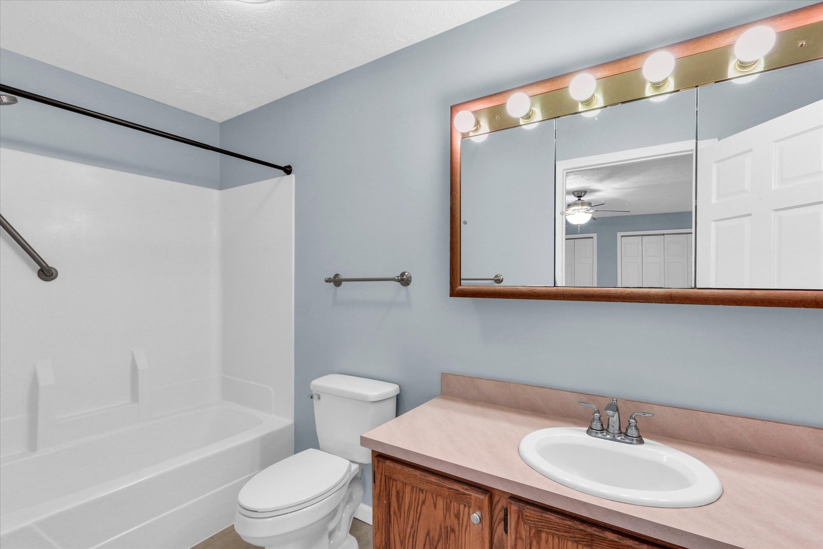 2302 Pheasant Ridge Road Mahomet, IL 61853 - Photo 17 of 31 a bathroom with a sink a toilet and shower