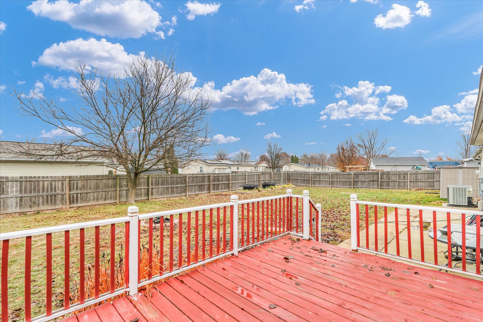 2302 Pheasant Ridge Road Mahomet, IL 61853 - Photo 24 of 31 a view of a lake with a deck