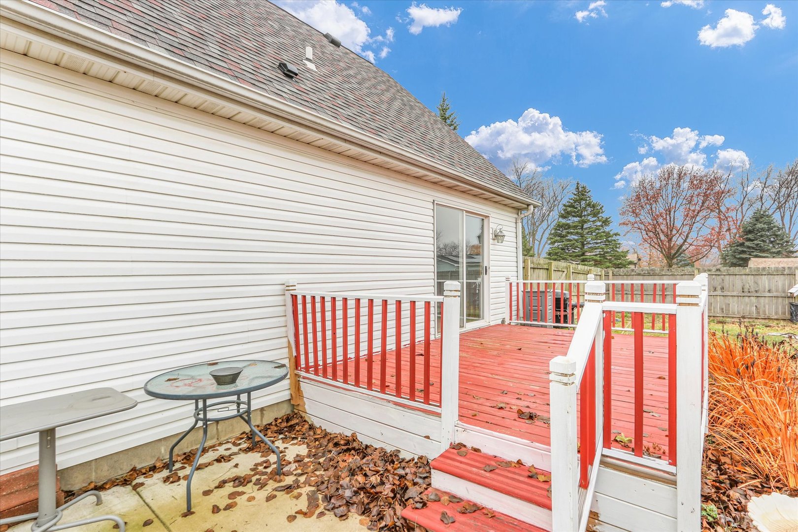 2302 Pheasant Ridge Road Mahomet, IL 61853 - Photo 25 of 31 a view of a patio with table and chairs and wooden floor