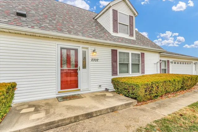 a view of a house with a garage