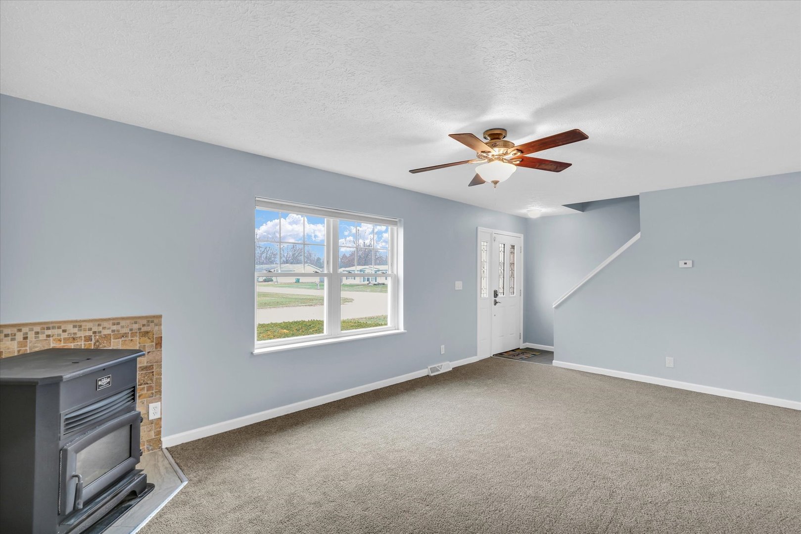 2302 Pheasant Ridge Road Mahomet, IL 61853 - Photo 7 of 31 a view of an empty room with a window