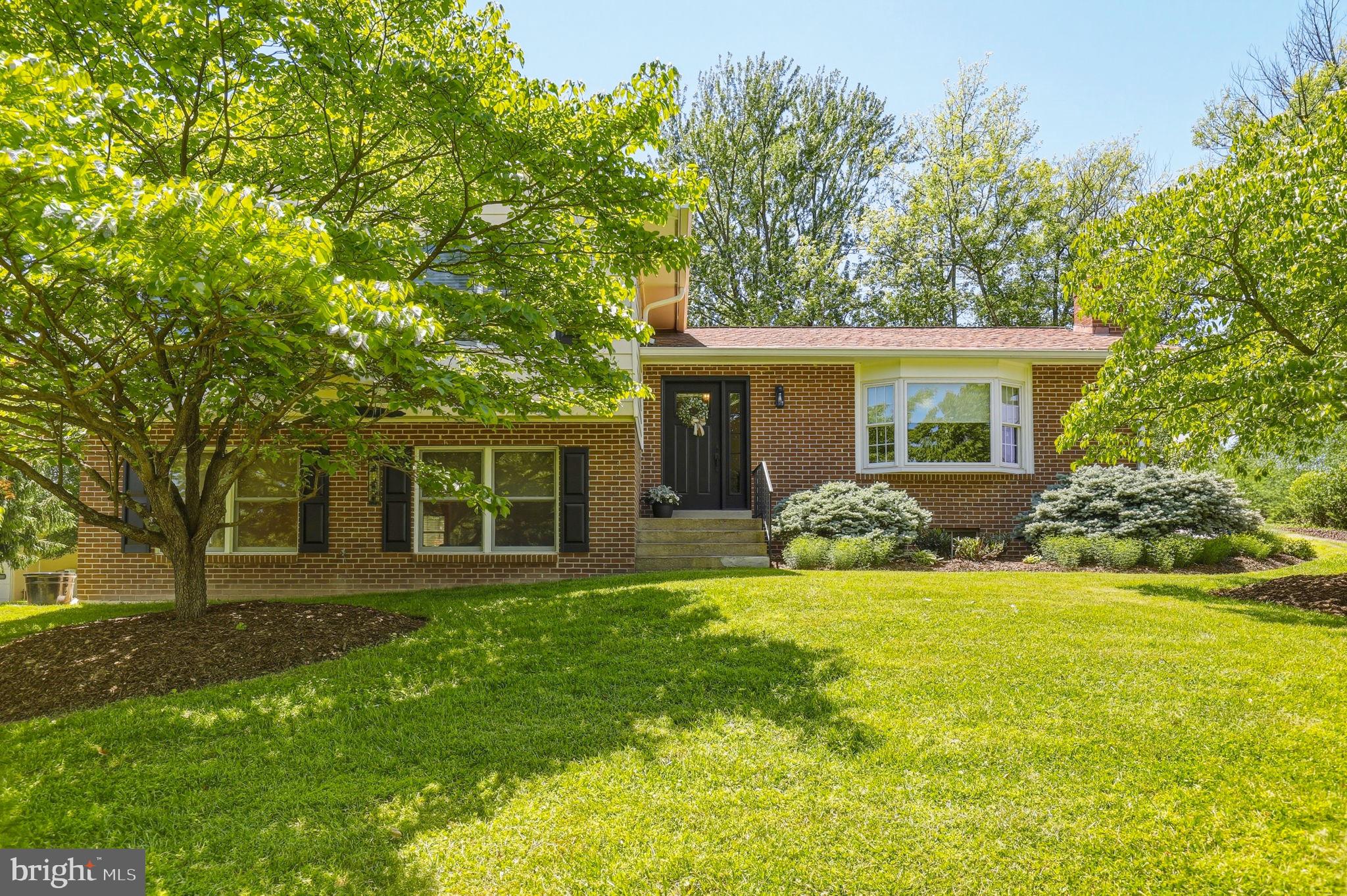 6336 Boyers Mill Road New Market, MD 21774 - Photo 1 of 49 a front view of house with yard and green space