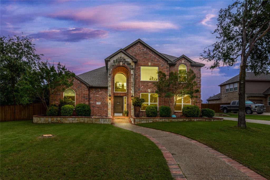 front view of a house with a yard