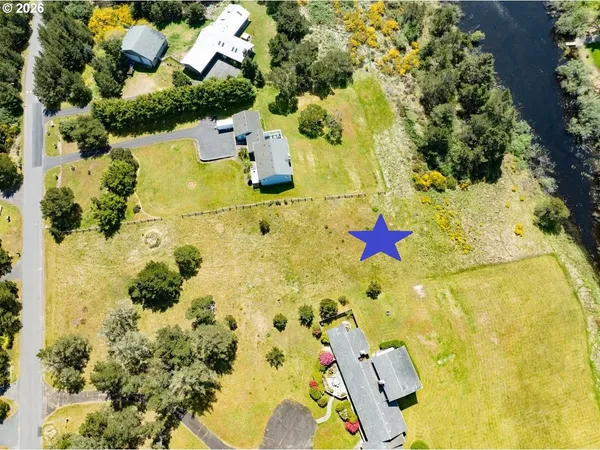 an aerial view of residential houses with swimming pool