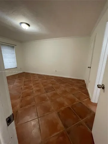 a view of a hallway with a room