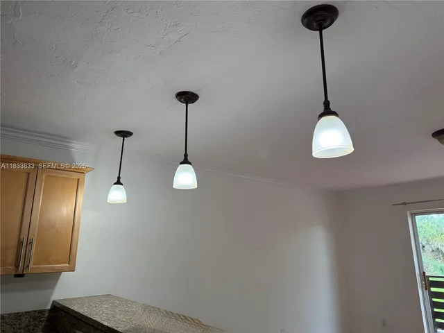 a stove top oven sitting inside of a kitchen
