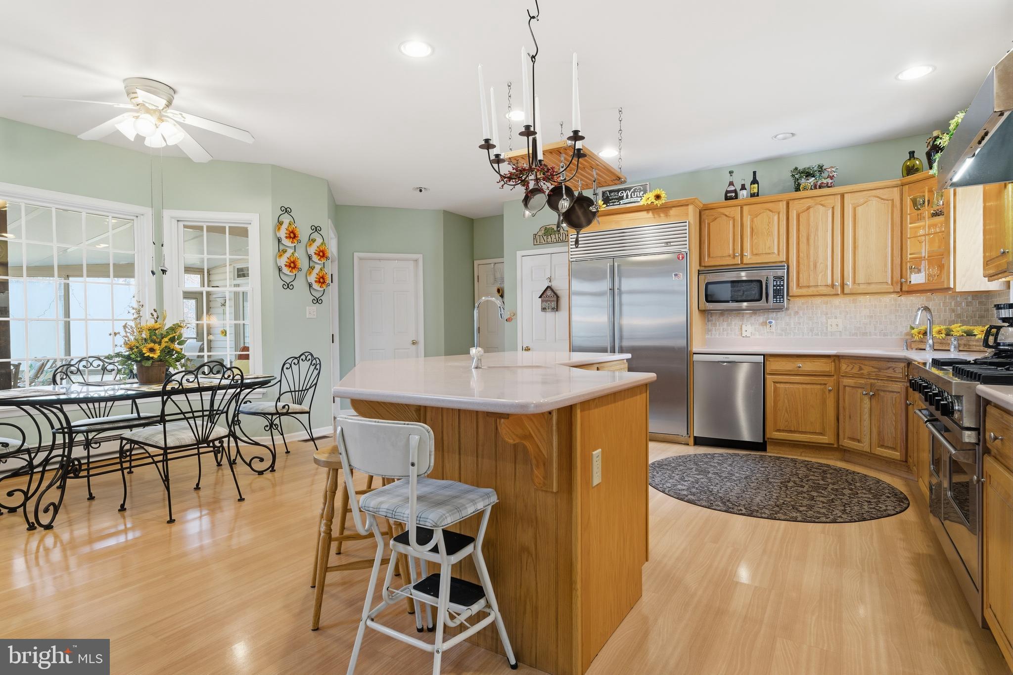 52 Harrisburg School Road Quakertown, PA 18951 - Photo 12 of 32 a kitchen with granite countertop a table chairs sink and stove
