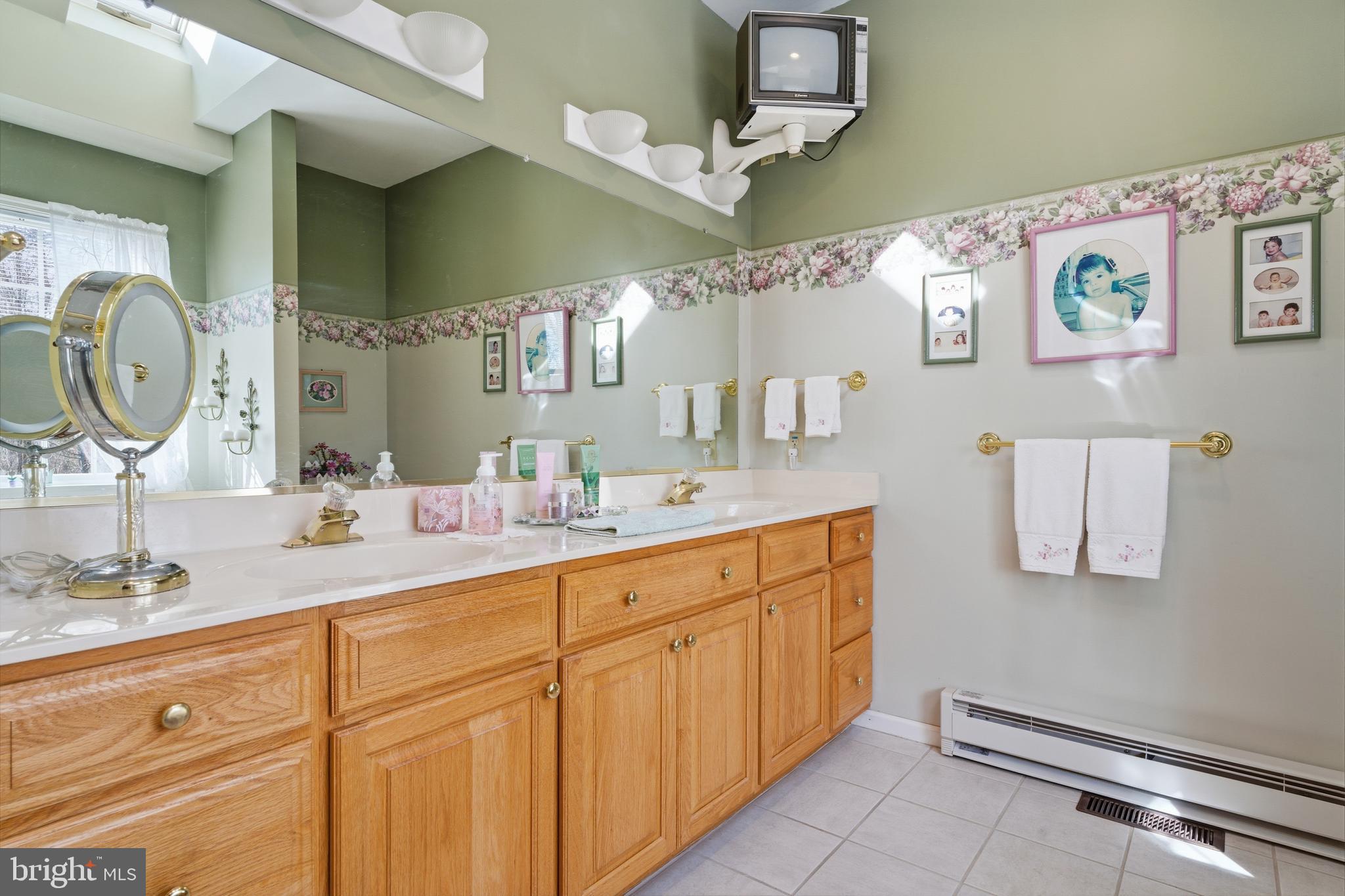 52 Harrisburg School Road Quakertown, PA 18951 - Photo 20 of 32 a bathroom with a granite countertop double vanity sink and a mirror