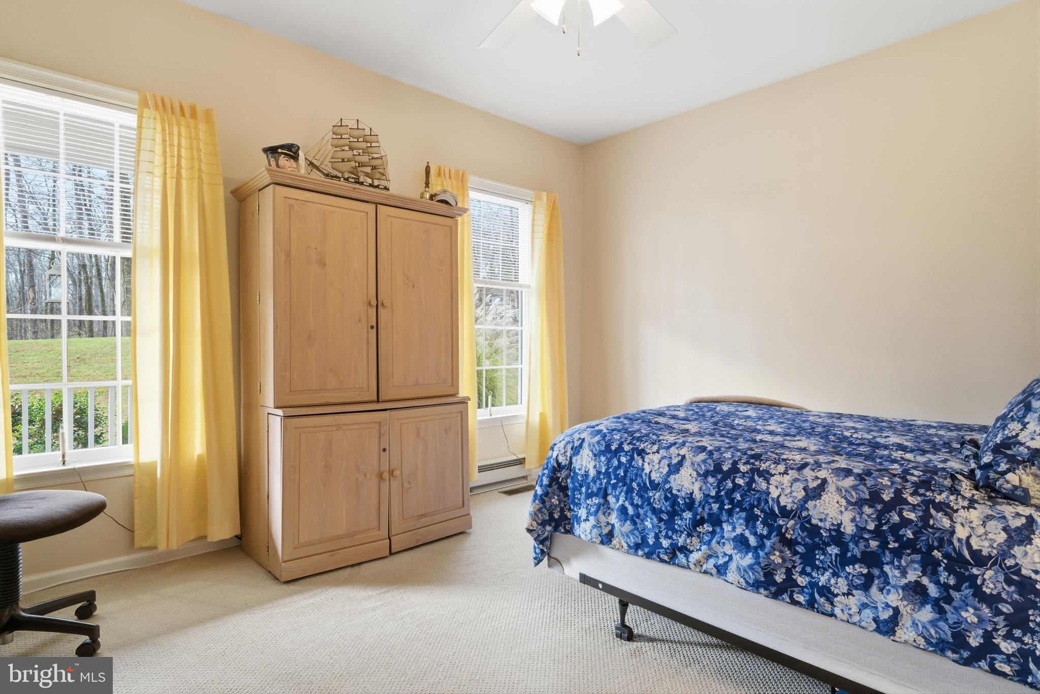 52 Harrisburg School Road Quakertown, PA 18951 - Photo 23 of 32 a bedroom with a bed a table and a dresser