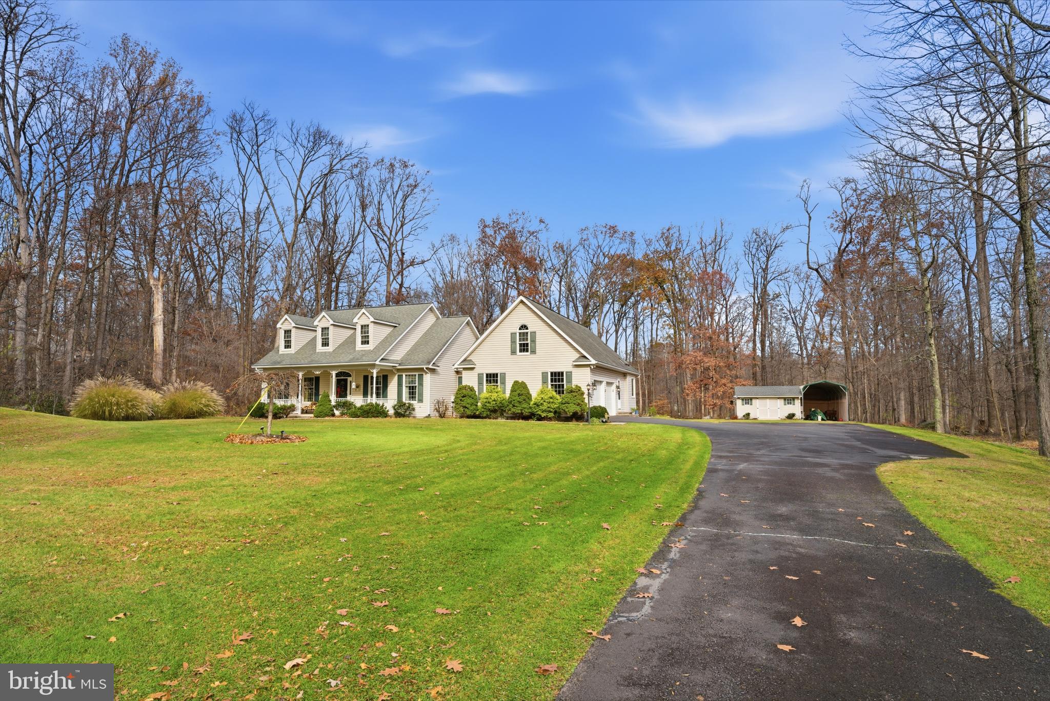 52 Harrisburg School Road Quakertown, PA 18951 - Photo 3 of 32 a front view of a house with a yard and trees