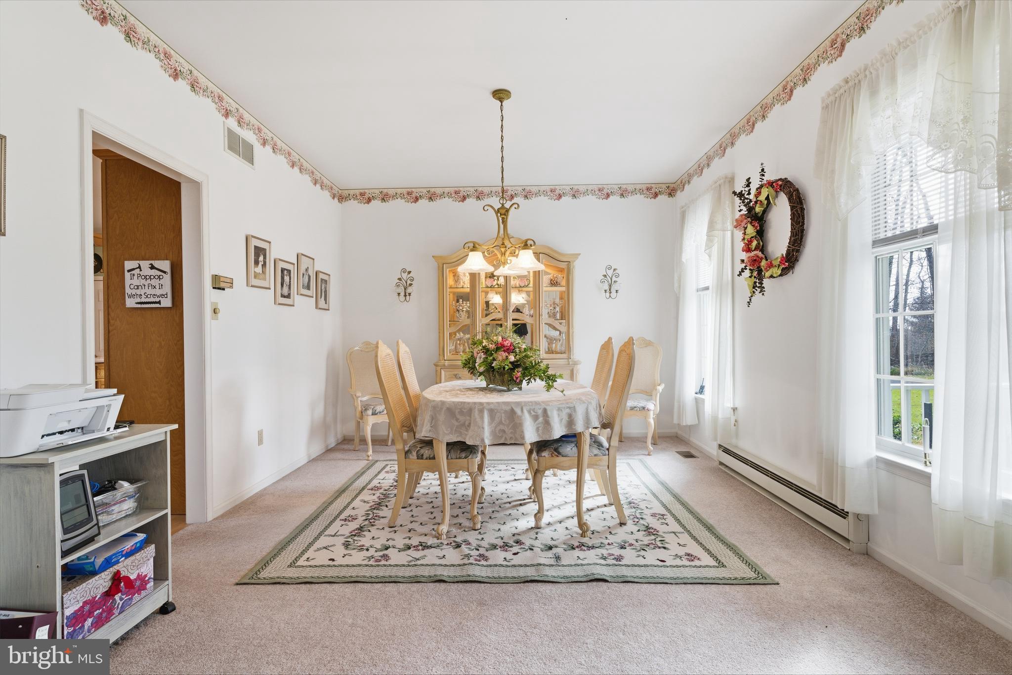 52 Harrisburg School Road Quakertown, PA 18951 - Photo 6 of 32 a dining room with furniture a rug and a chandelier