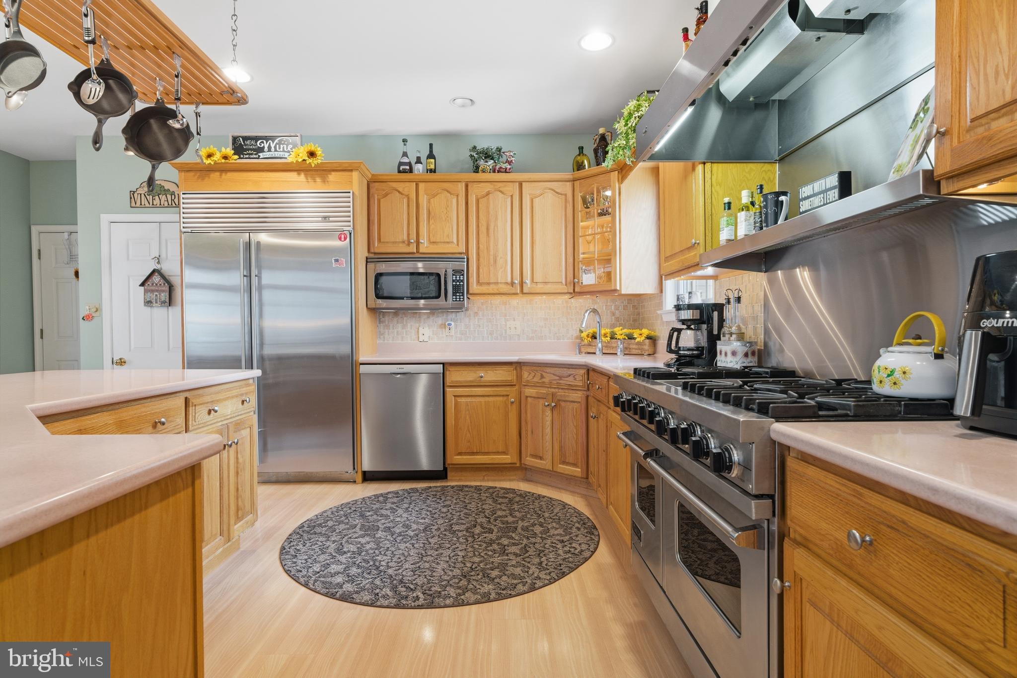 52 Harrisburg School Road Quakertown, PA 18951 - Photo 10 of 32 a kitchen with stainless steel appliances granite countertop a sink a stove and a wooden floors