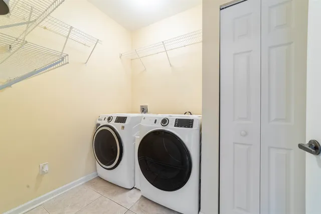 a utility room with dryer and washer