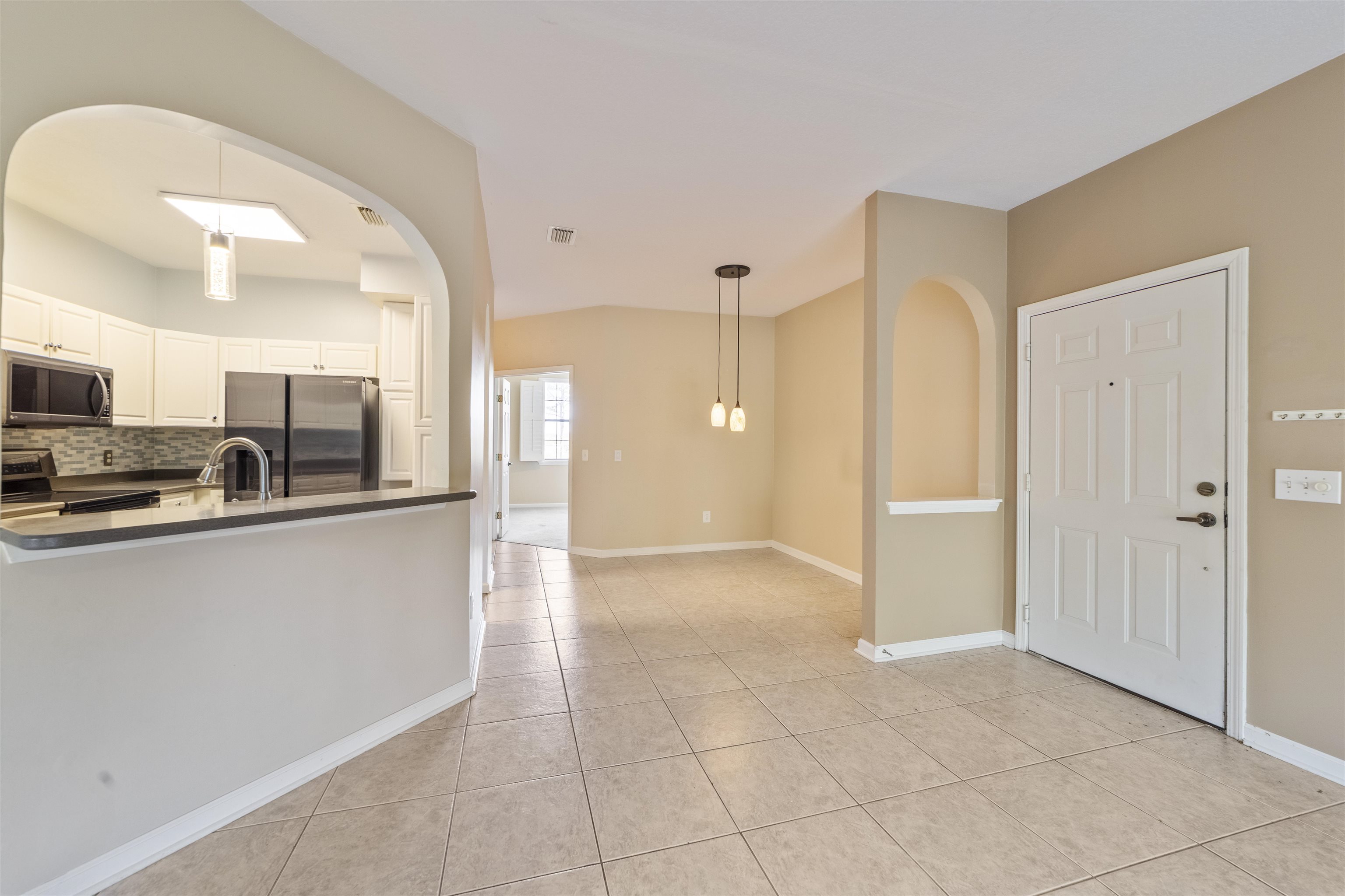 3225 Haley Pointe Road St. Augustine, FL 32084 - Photo 15 of 35 a view of a kitchen with a sink and a refrigerator