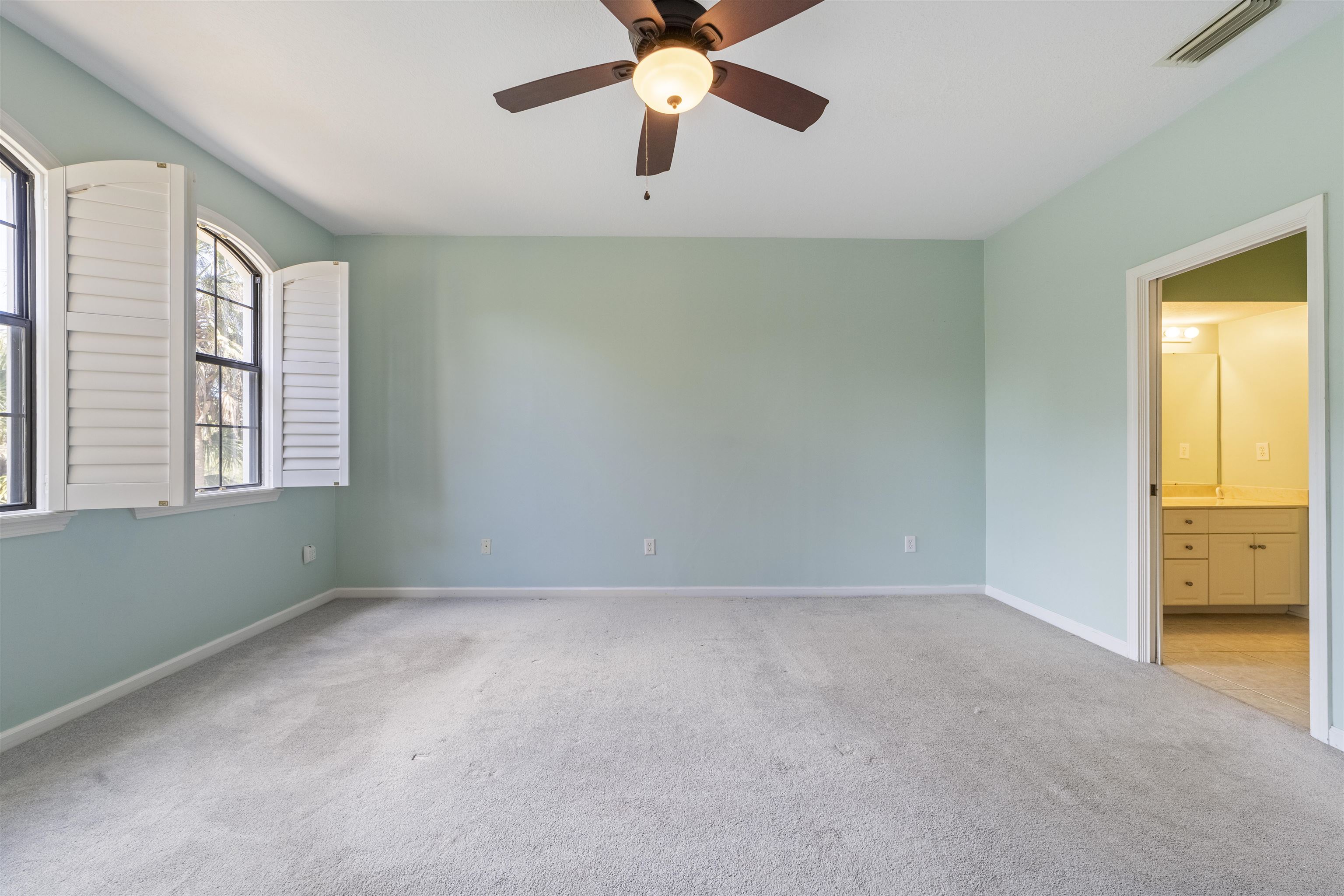 3225 Haley Pointe Road St. Augustine, FL 32084 - Photo 27 of 35 a view of an empty room with window and chandelier fan