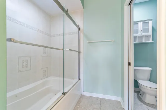 a view of a lake with houses in the back