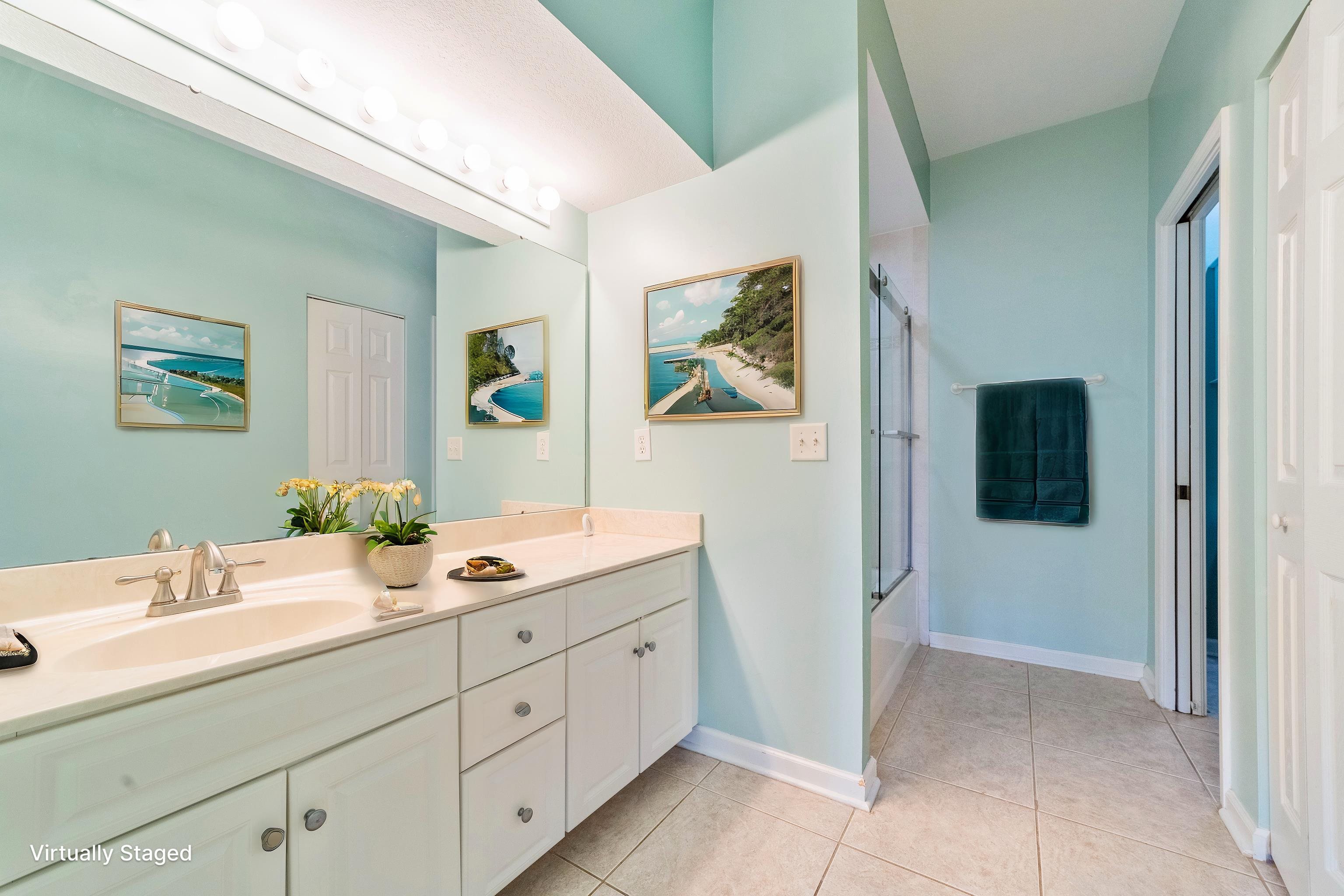 3225 Haley Pointe Road St. Augustine, FL 32084 - Photo 9 of 35 a bathroom with a double vanity sink and mirror