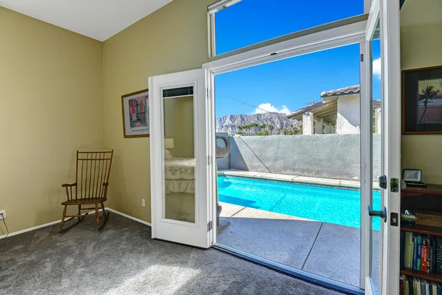 a spacious bedroom with a bed and a table