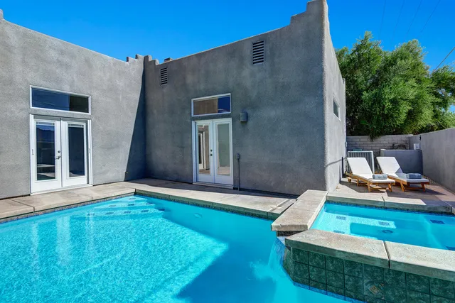 a aerial view of a house with pool