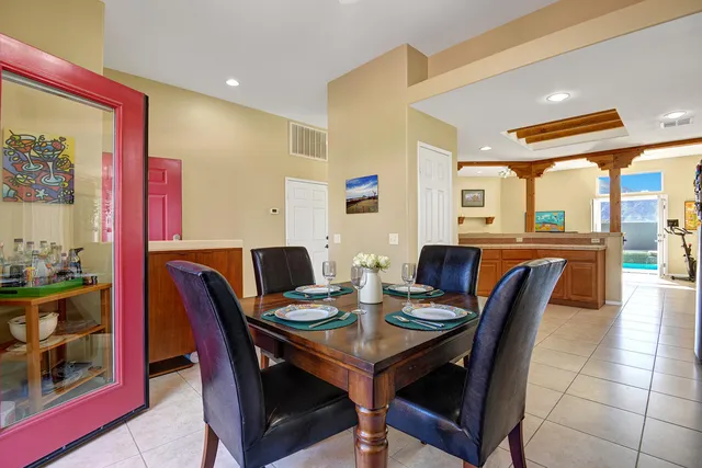 a dining room with furniture and window
