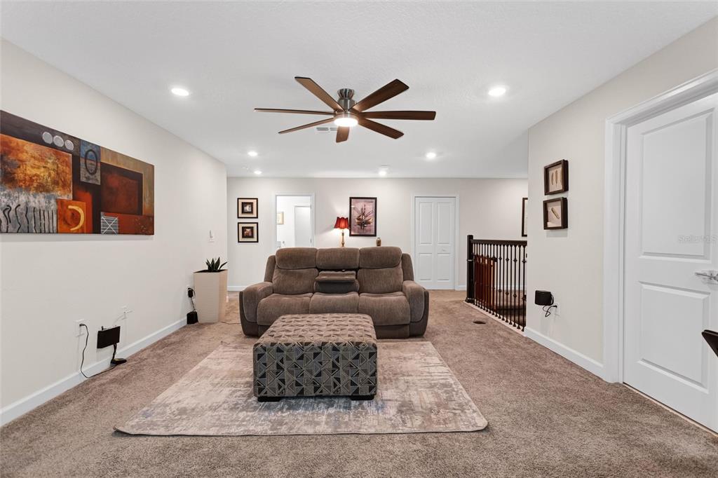 1089 Blackwolf Run Road Davenport, FL 33896 - Photo 26 of 82 a living room with furniture and a large window