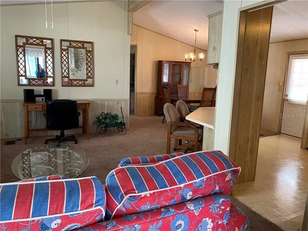 a bedroom with furniture and a wooden floor