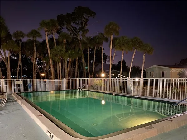 a view of a swimming pool with a patio