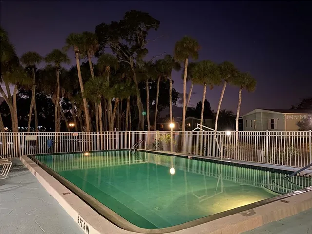 a view of a swimming pool with a patio