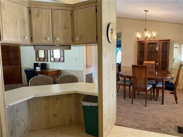 a kitchen with a table and chairs
