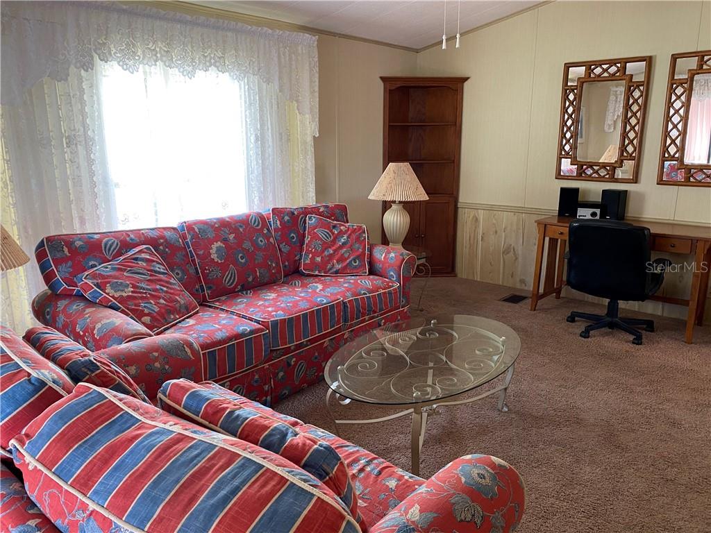 3 Meadow Circle Ellenton, FL 34222 - Photo 5 of 17 a living room with furniture a rug and a window