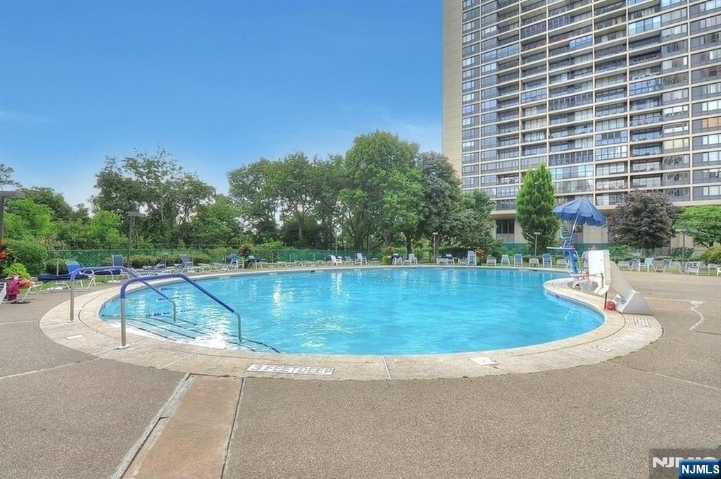 4 Horizon Road, Unit 416 Fort Lee, NJ 07024 - Photo 26 of 29 a view of a swimming pool with a patio