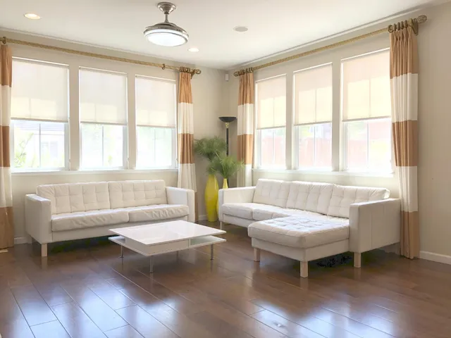 a living room with furniture and a window