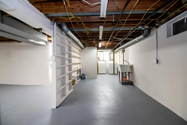 a view of storage and utility room with stairs