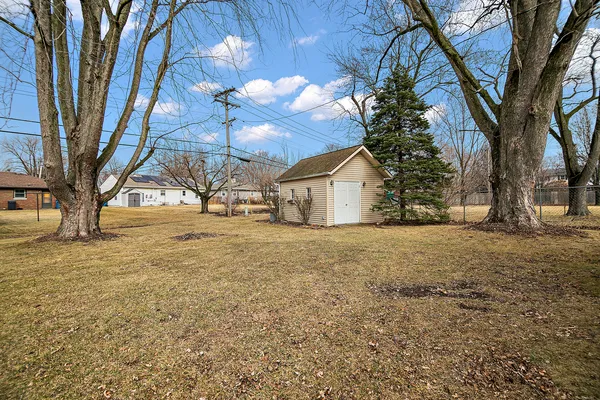 a view of large house with a yard
