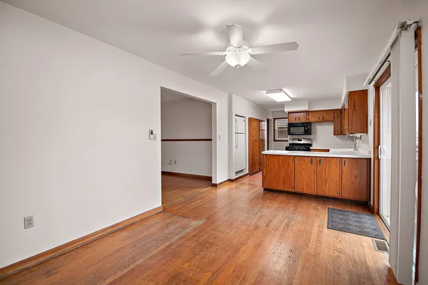 a view of kitchen with cabinets and wooden floor