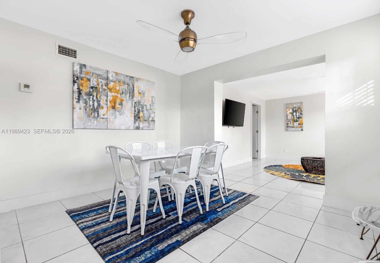 38 Miami Gardens Road West Park, FL 33023 - Photo 11 of 30 a view of a dining room with furniture