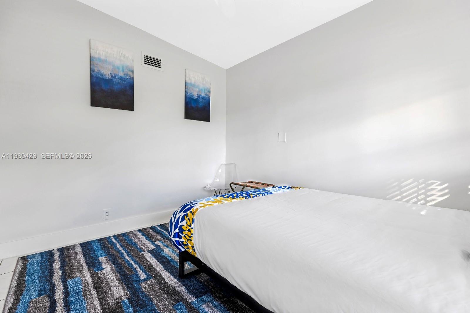 38 Miami Gardens Road West Park, FL 33023 - Photo 18 of 30 a bedroom with a bed and the wall painting