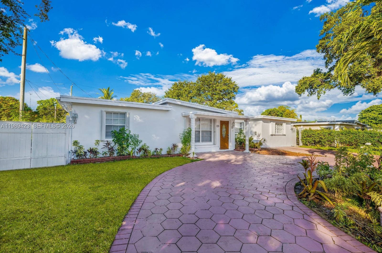 38 Miami Gardens Road West Park, FL 33023 - Photo 5 of 30 a view of a house with a yard and garden