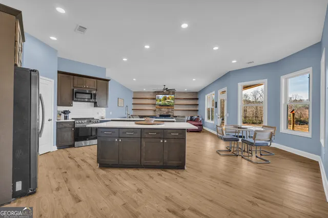 a kitchen with a sink appliances and cabinets